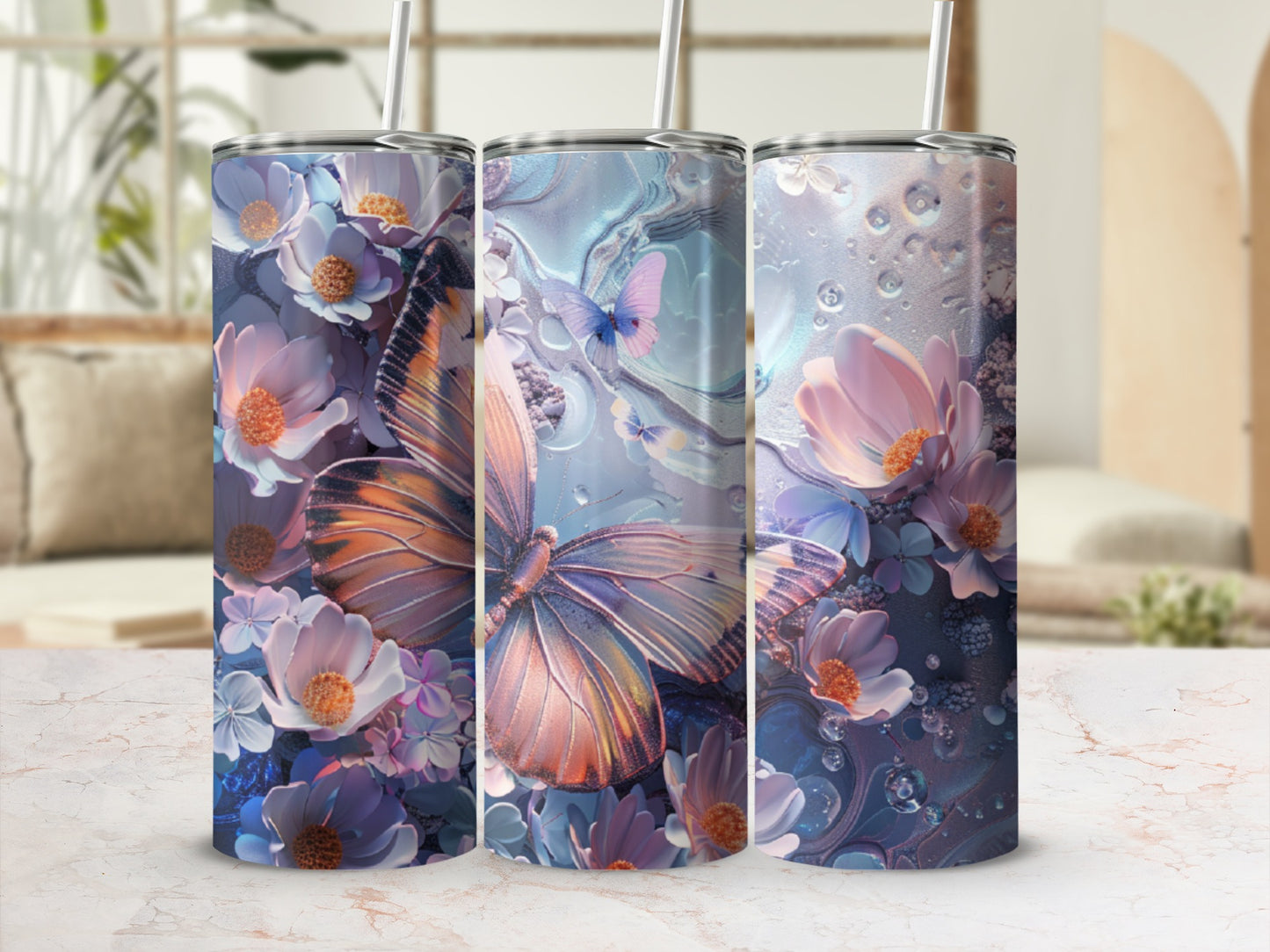 Three tumblers with floral and butterfly designs in purple and orange hues.