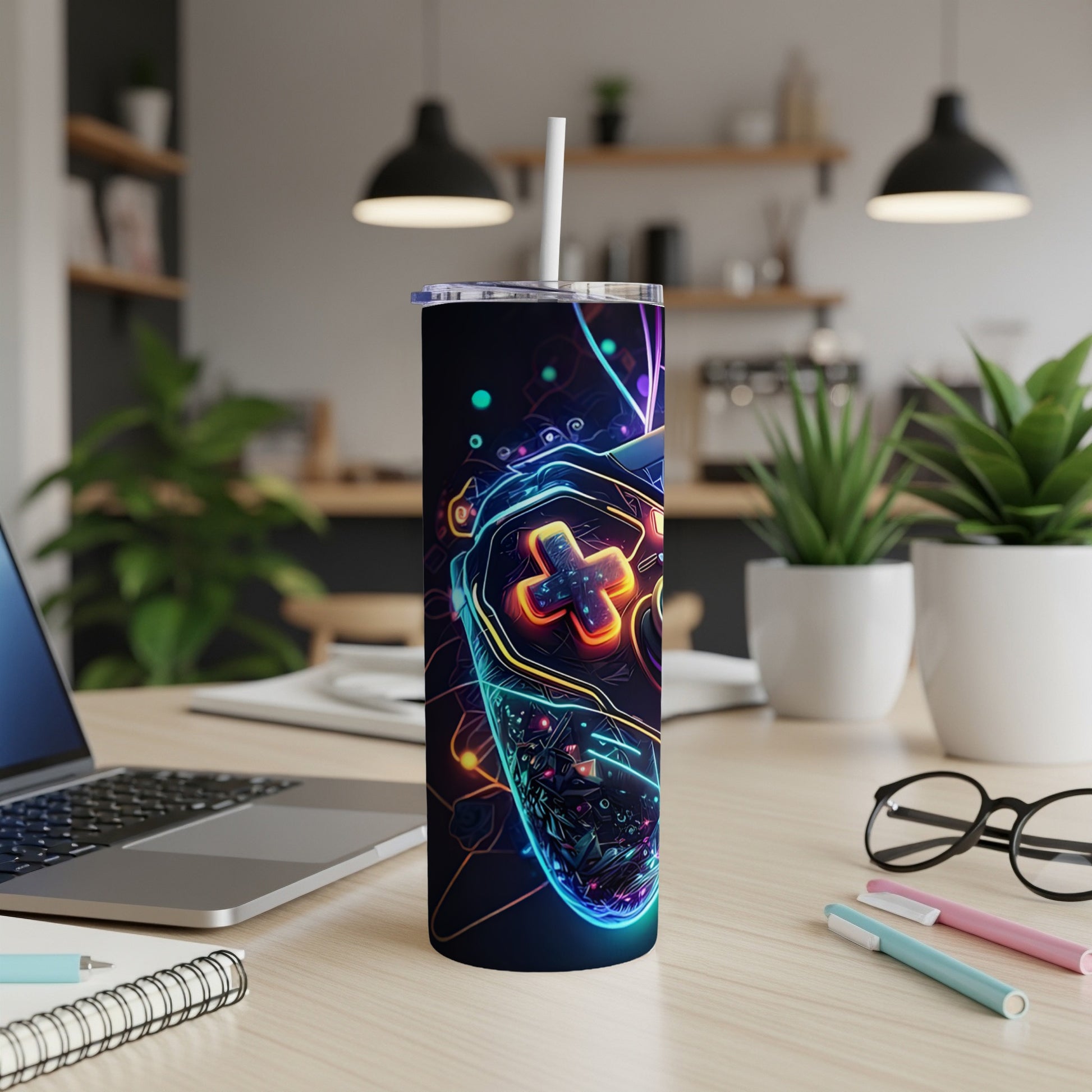 Glow-in-the-dark gaming controller design on a skinny tumbler with straw.