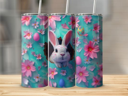 Easter bunny peeking through a floral background on three tumblers.