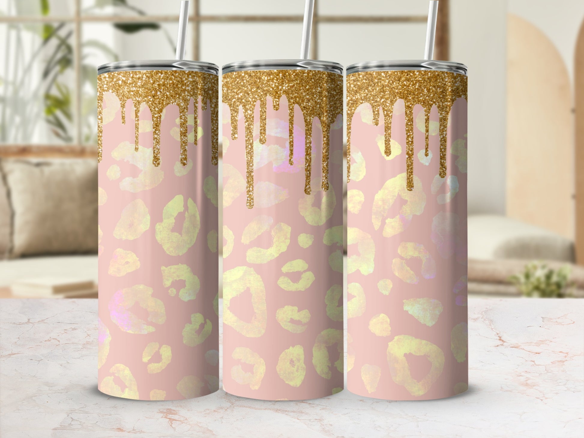 Pink leopard print tumbler with gold glitter drips.
