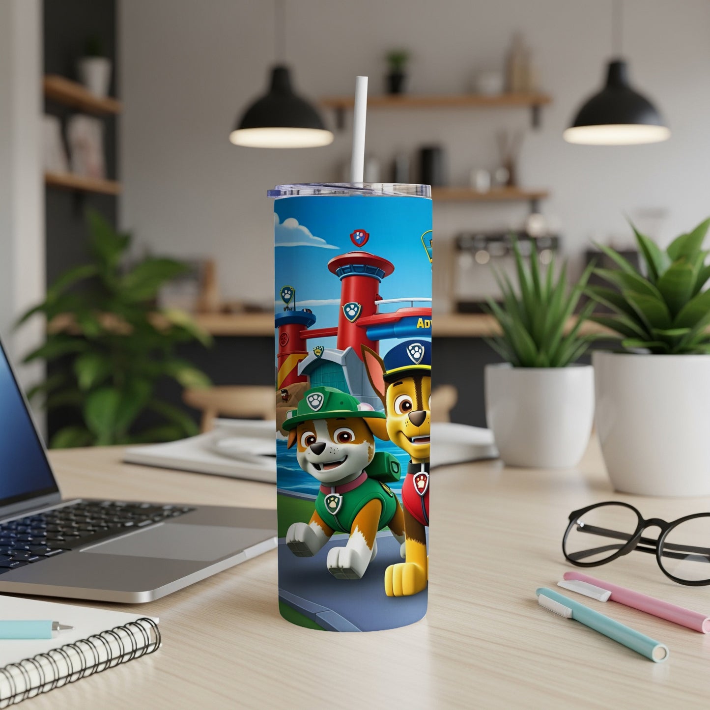 Paw Patrol characters Chase and Marshall on a blue tumbler with a straw.