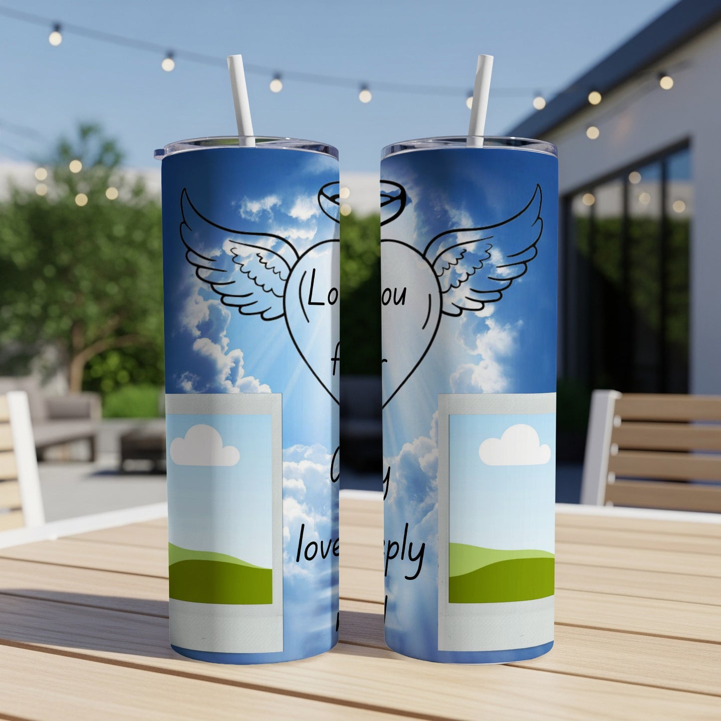 Two tumblers with a sky and clouds design, featuring a winged heart and text.