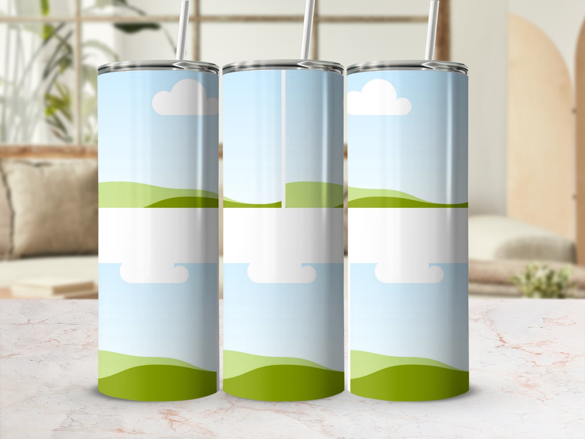 Three tumblers with a sky and rolling hills design and a white label area.