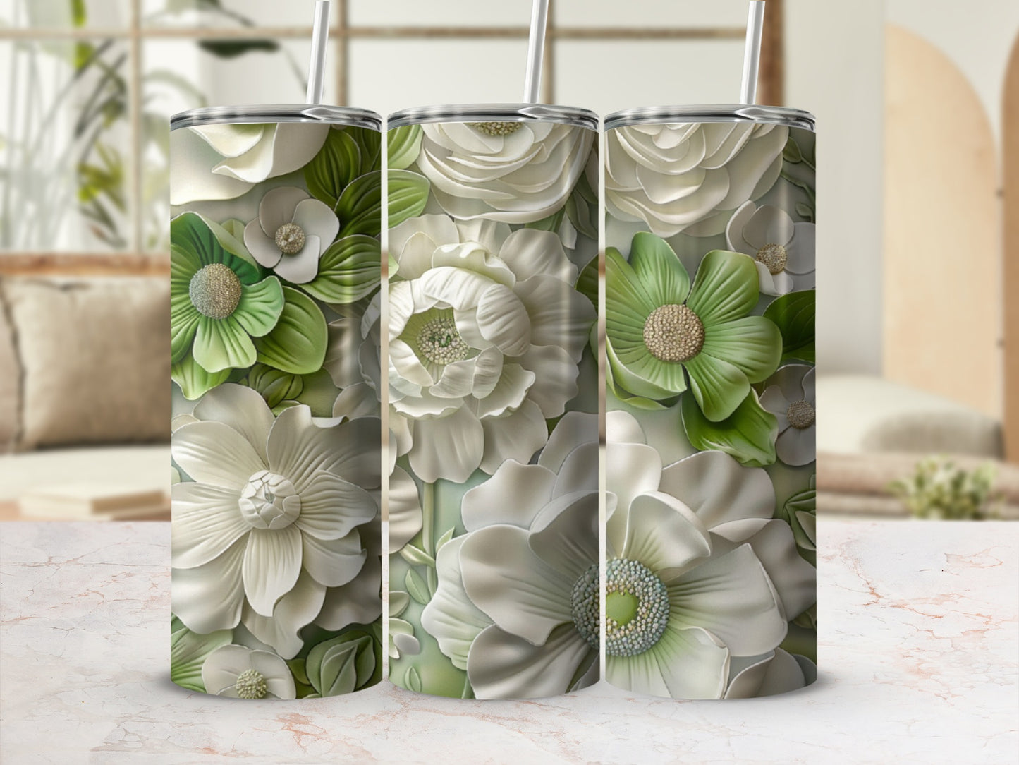 Three tumblers with embossed white and green floral designs.