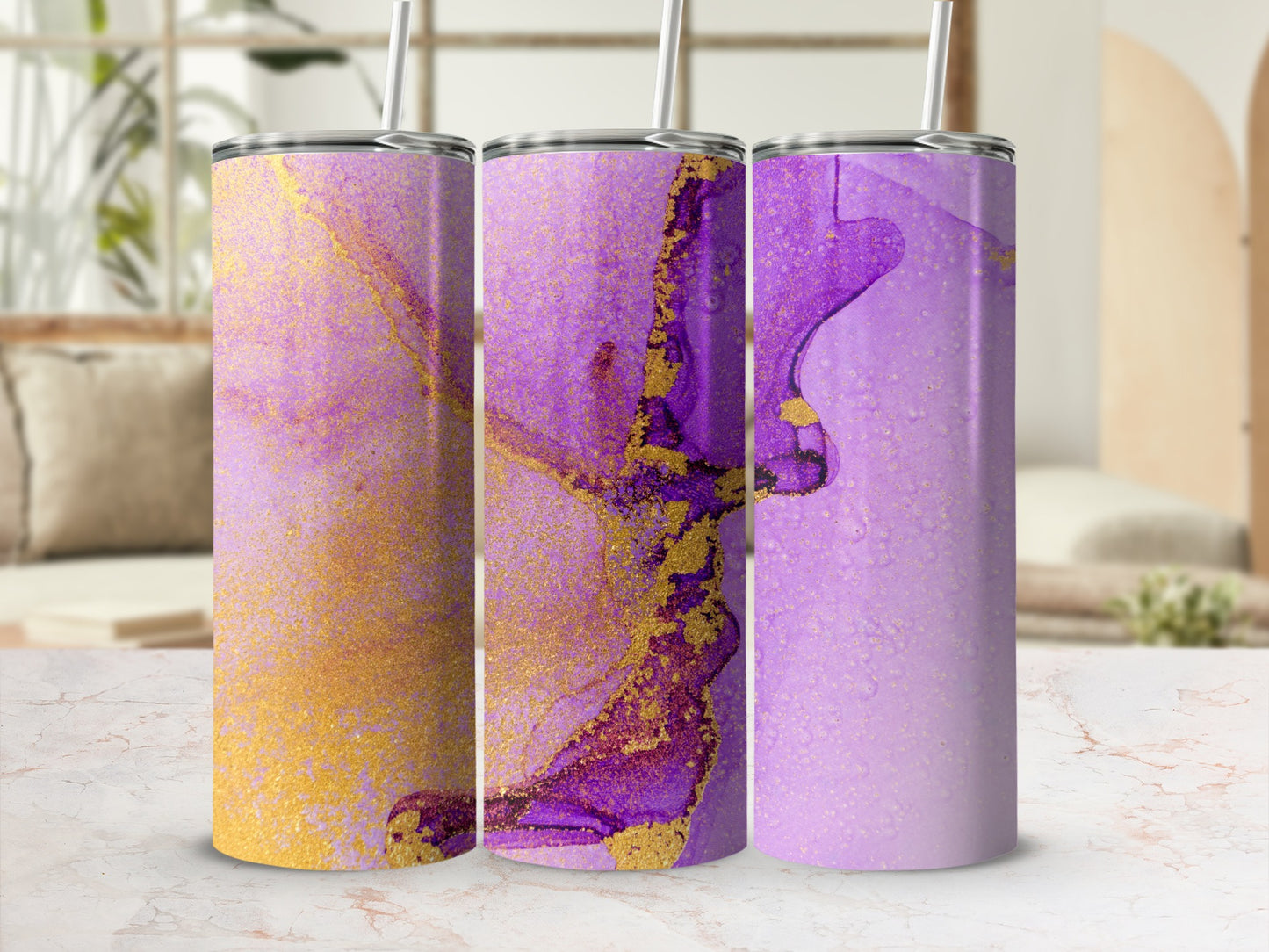 Three tumblers with purple and gold abstract watercolor designs.