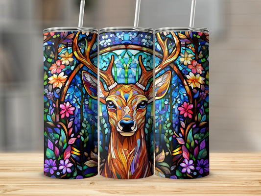 Stained glass deer surrounded by colorful flowers and leaves.