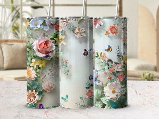 Floral pattern with butterflies on three tall tumblers with straws.