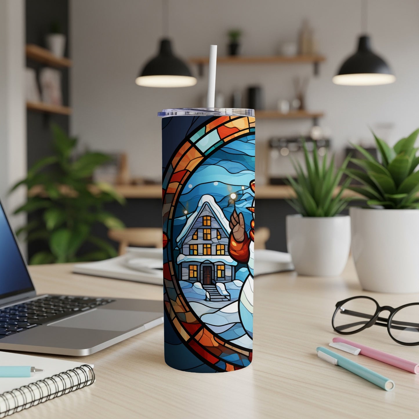 Snowman and house in stained glass design on a skinny tumbler.
