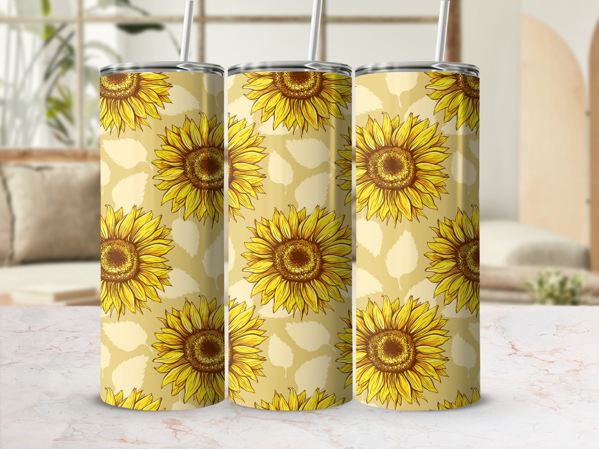 Three tumblers with a repeating sunflower pattern on a pale yellow background.