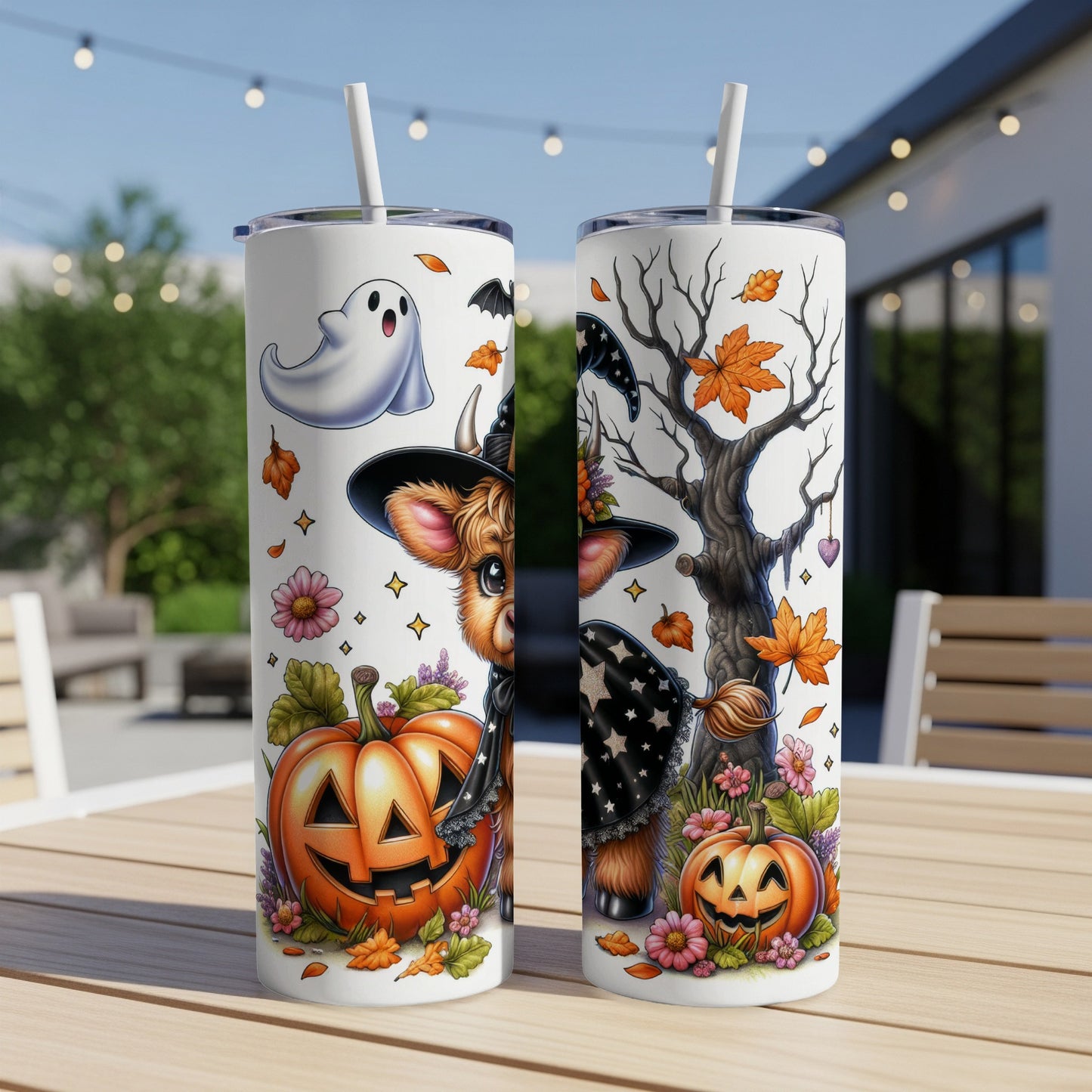 Two Halloween tumblers with spooky cow, ghost, and pumpkin designs.