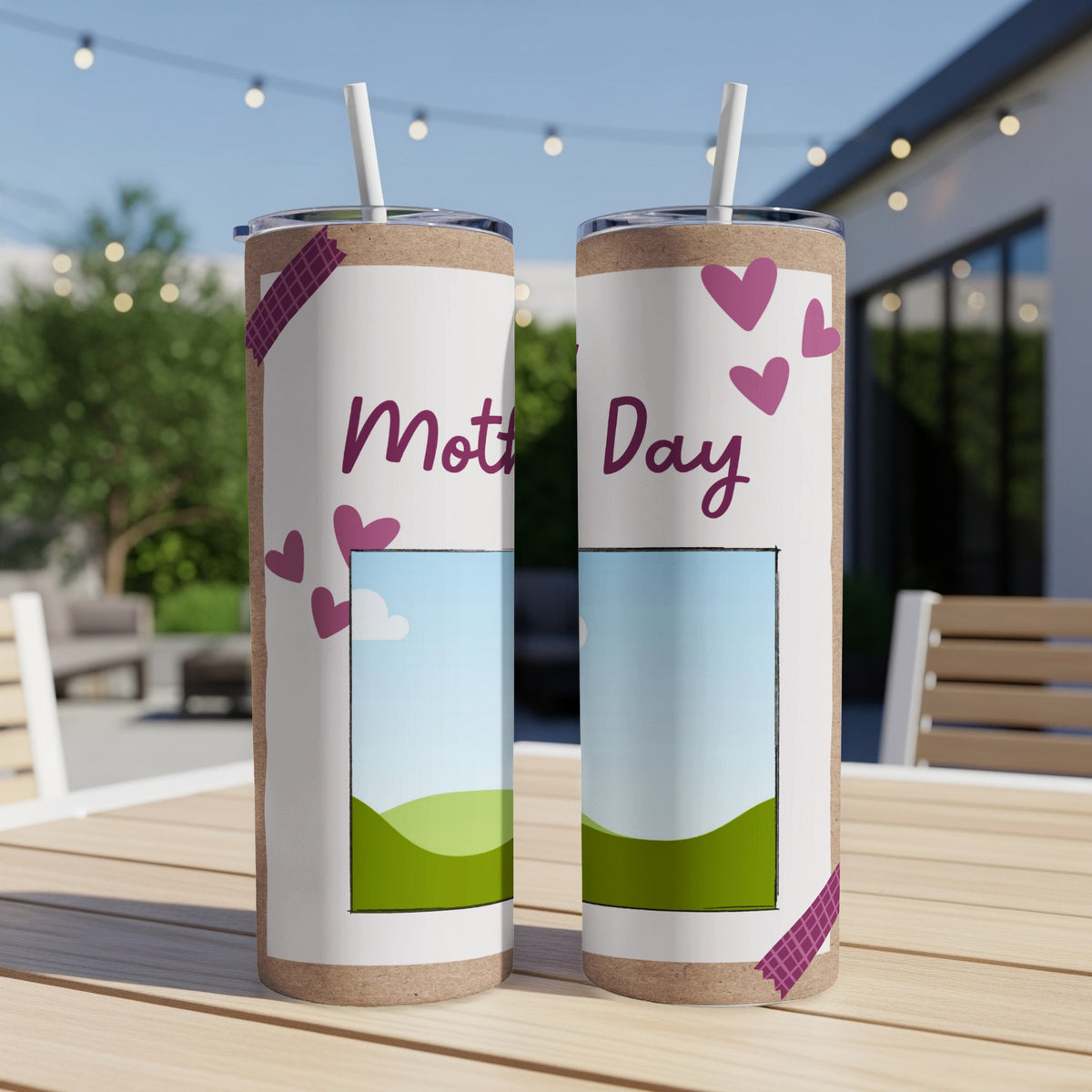 Two tumblers with "Mothers Day" text, hearts, and photo frames on a wooden table.