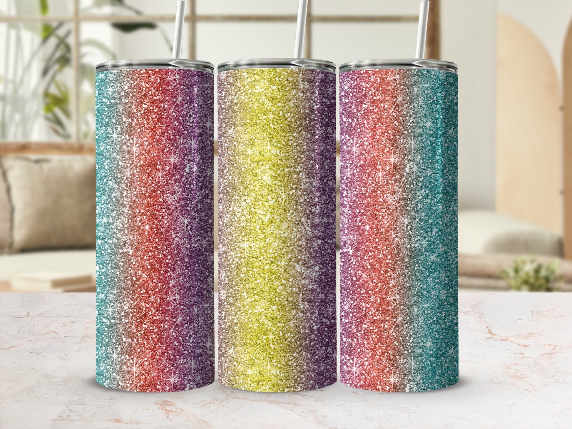 Three tumblers with glitter gradient designs in teal, purple, yellow, and red.