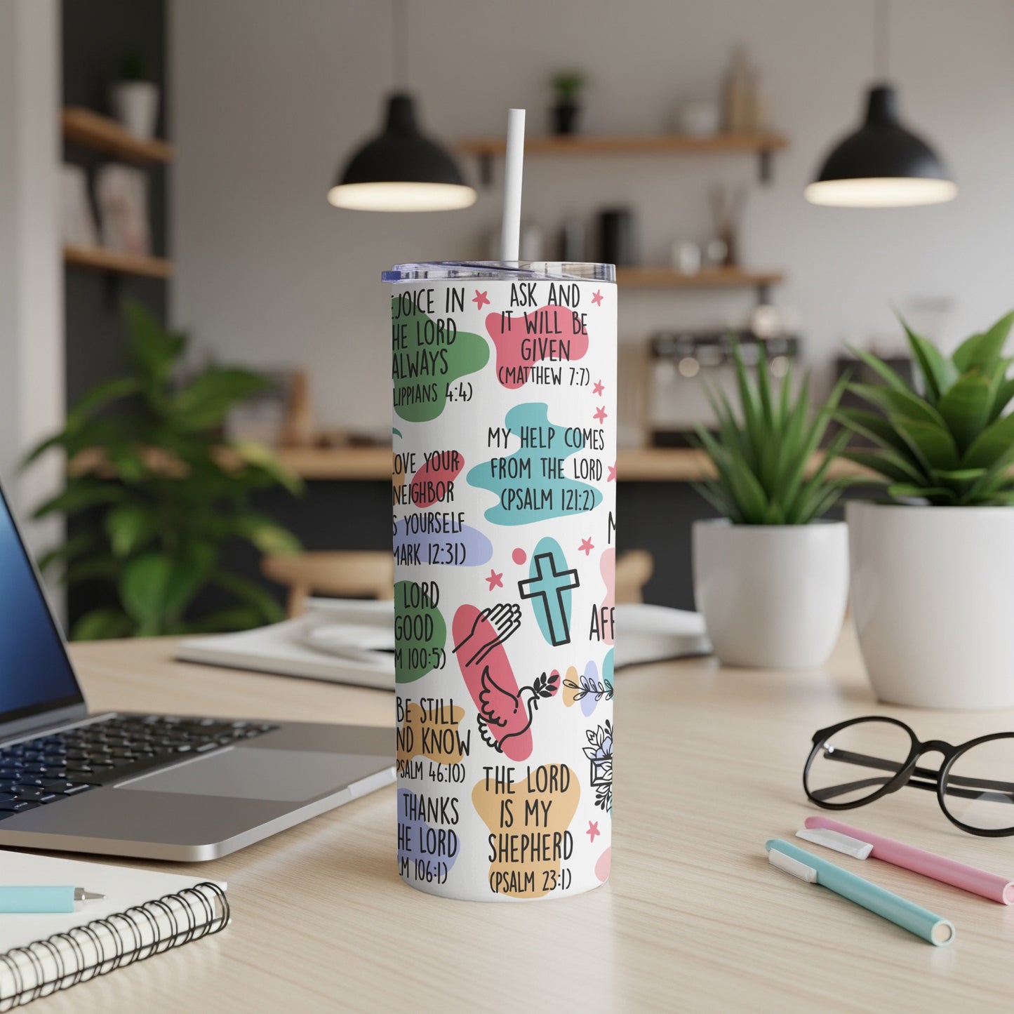 Multicolor tumbler with Bible verses and Christian symbols.