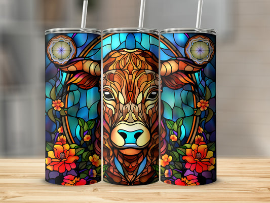 Three stained glass tumblers featuring a cow's head surrounded by floral patterns.