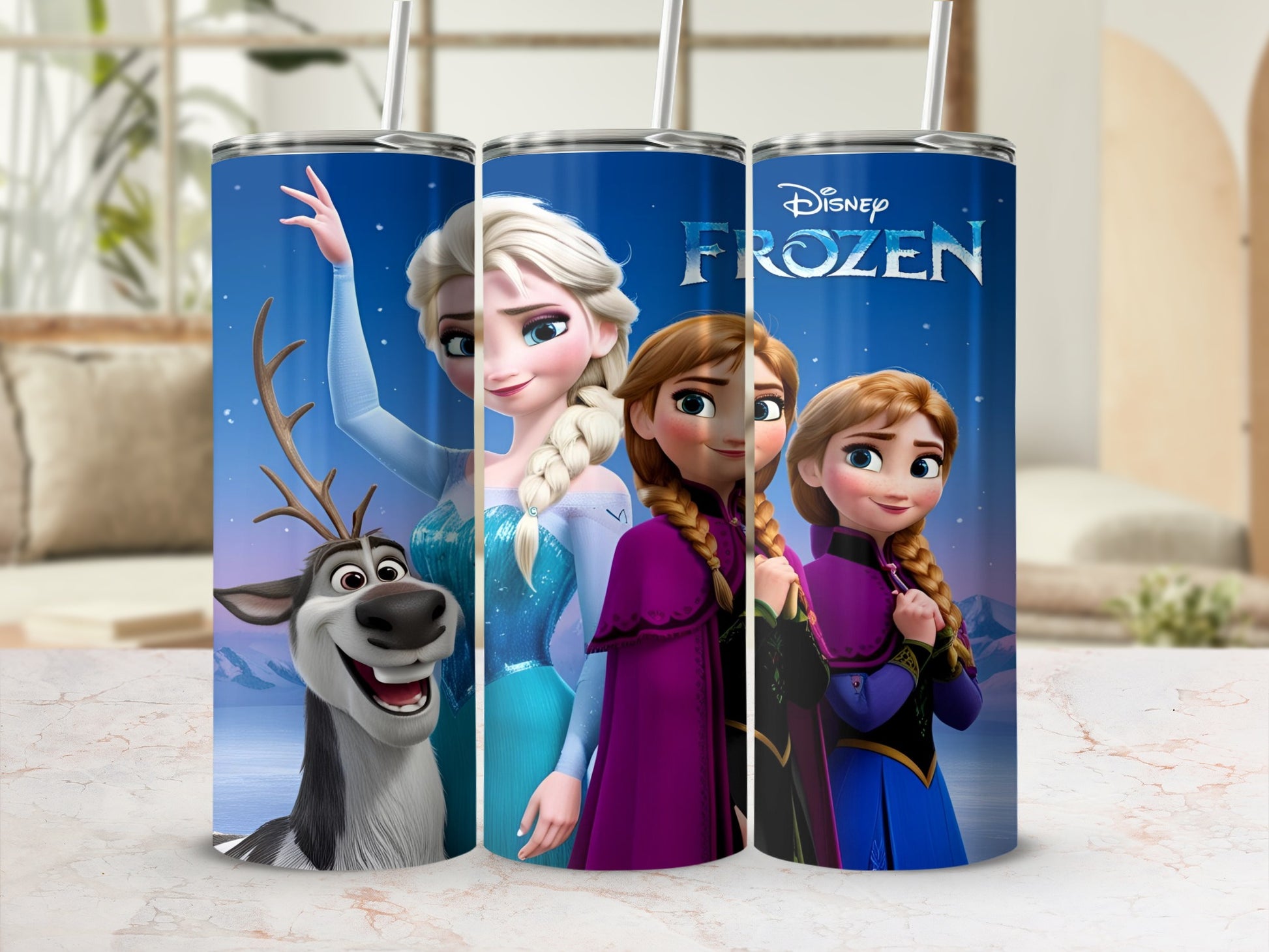 Frozen characters Elsa, Anna, and Sven on a blue tumbler with straws.
