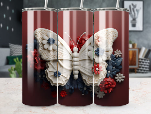 Maroon tumbler with white butterfly and floral embellishments.