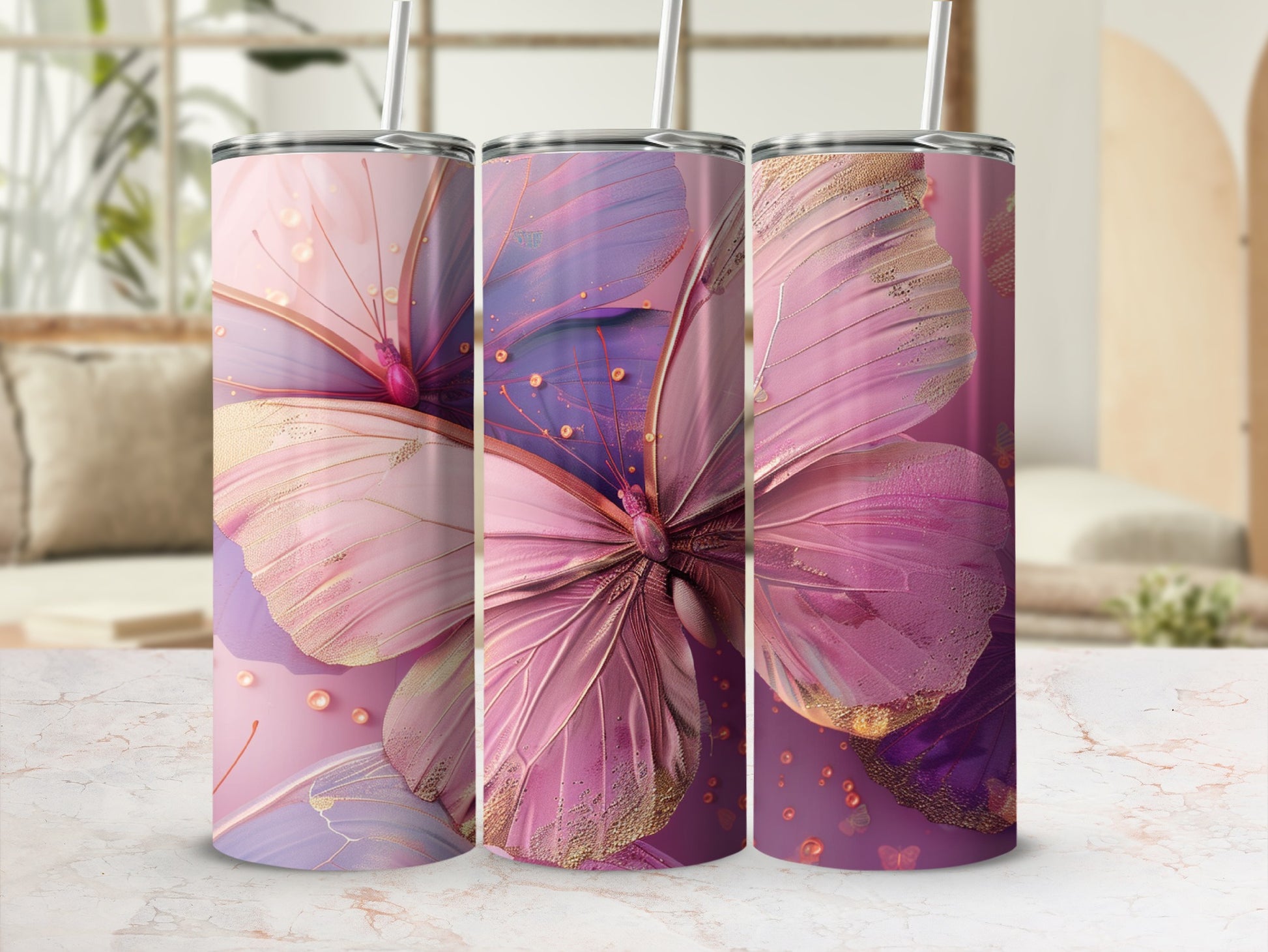 Three tumblers with a large pink butterfly and gold accents.