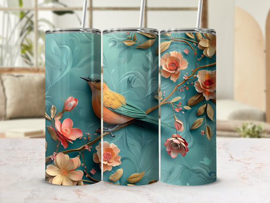 Turquoise tumbler with a bird on a floral branch.