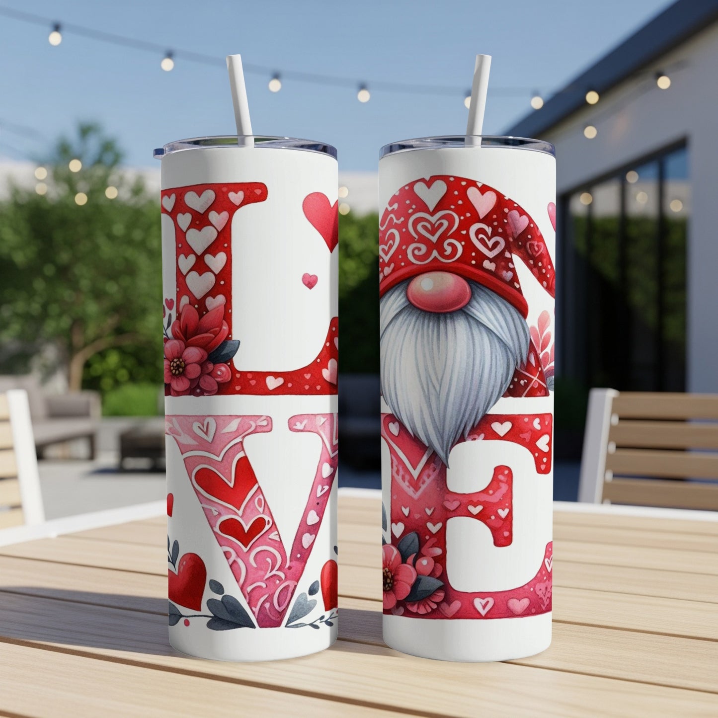 Gnome and "Love" text design on two white tumblers with straws.