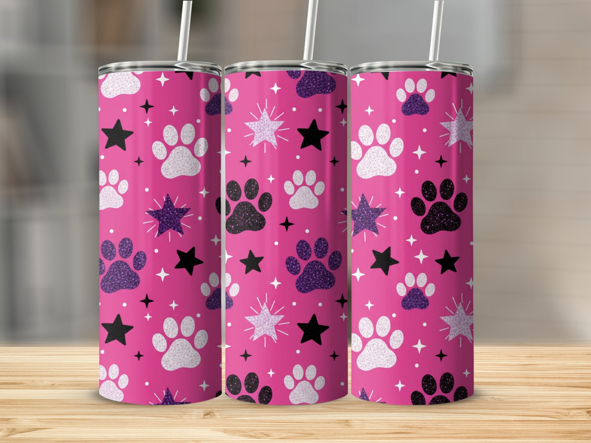 Pink tumbler with paw prints, stars, and glitter.