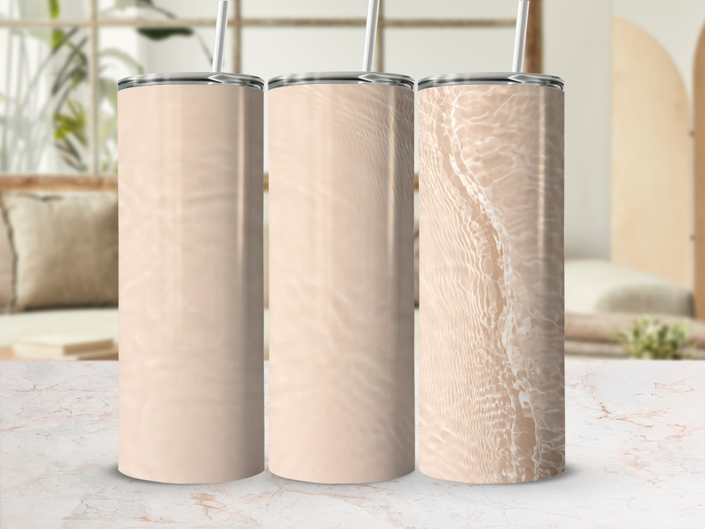 Three tall, insulated tumblers with neutral, rippling water designs.