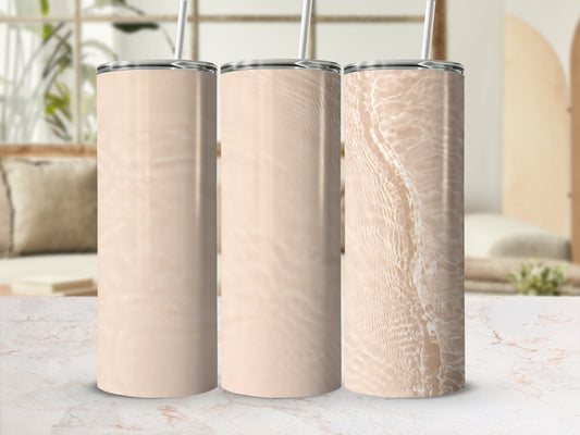Three tall, insulated tumblers with neutral, rippling water designs.