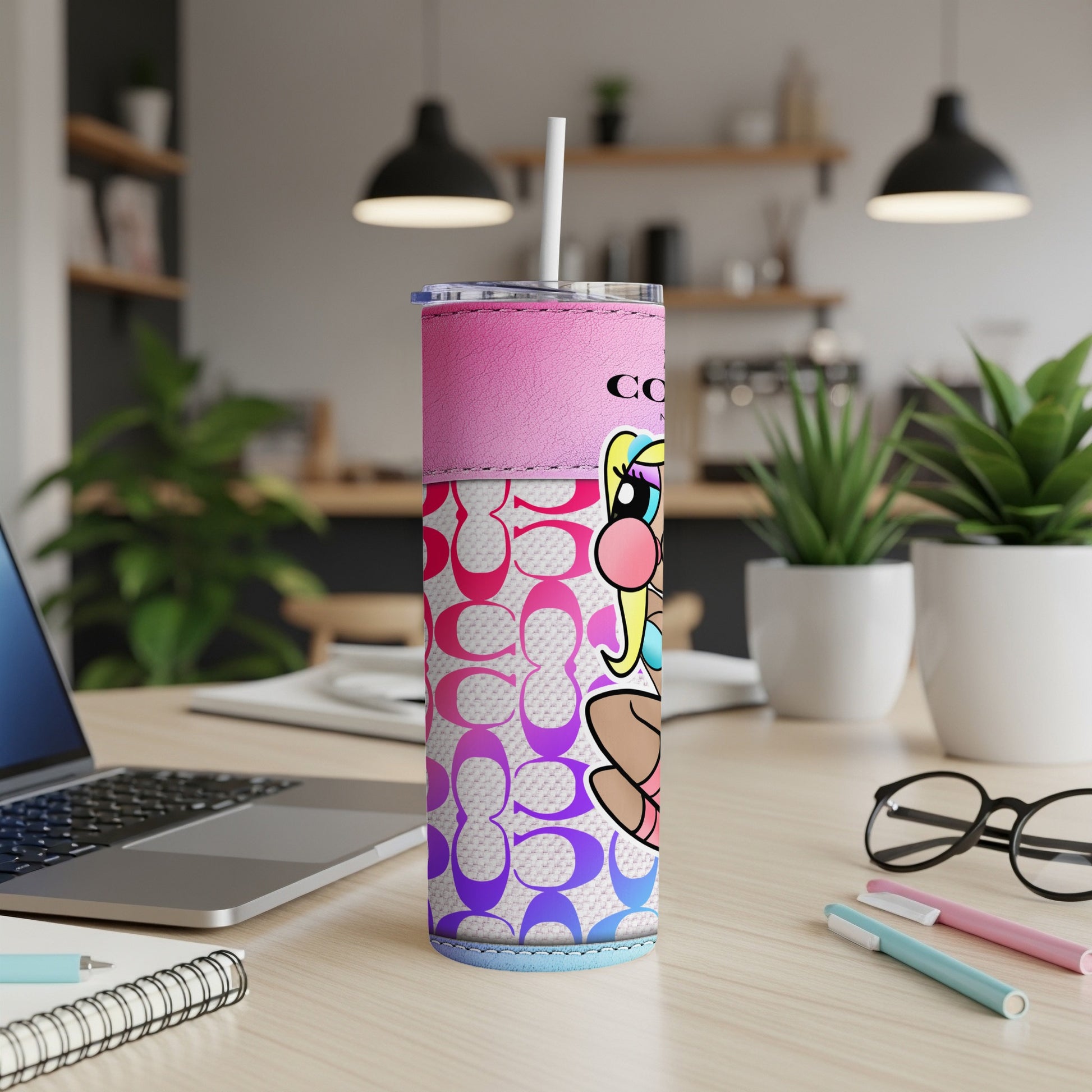 Pink tumbler featuring the Coach logo pattern and cartoon character illustration.
