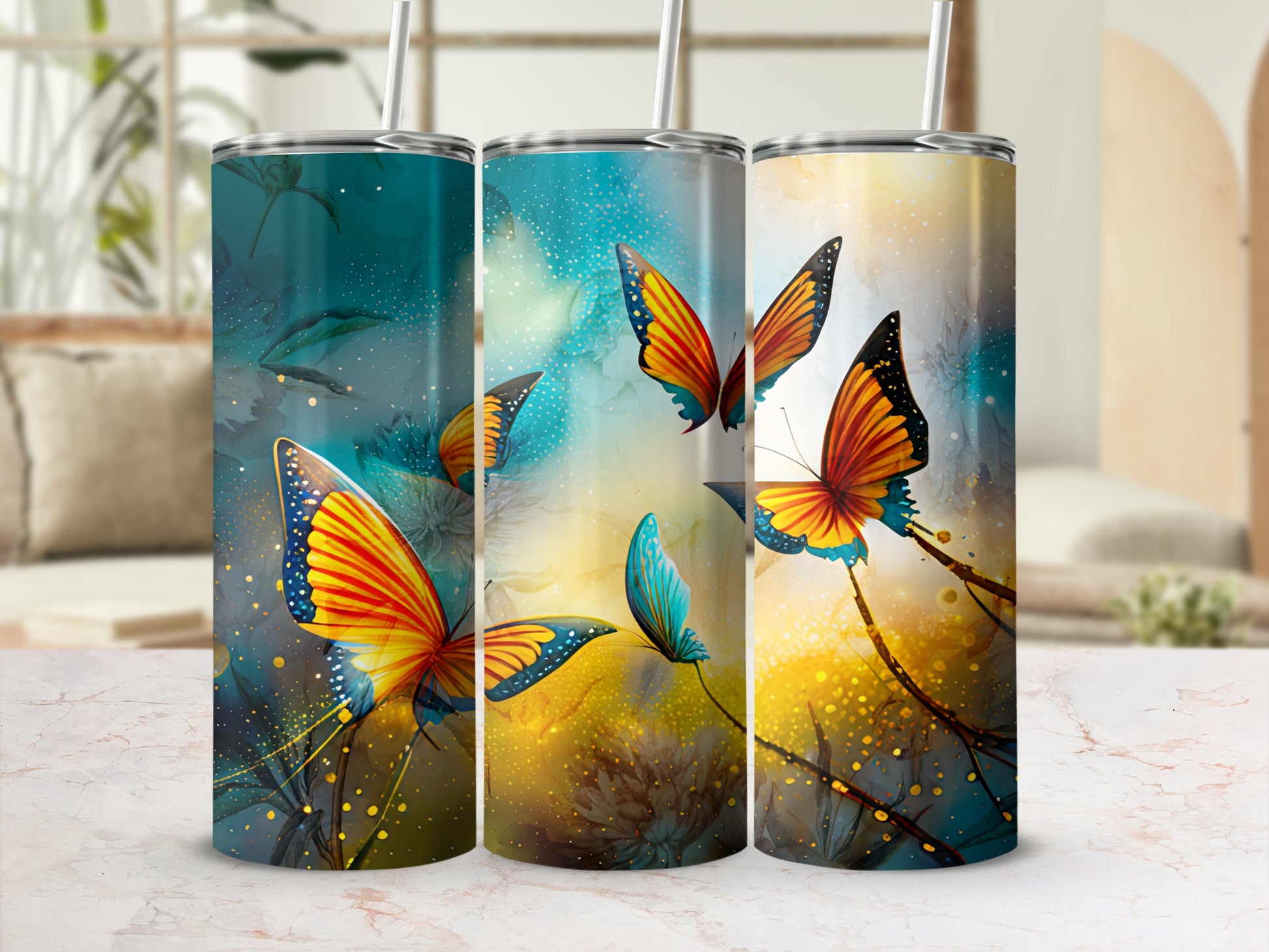 Three tumblers with vibrant butterfly and floral abstract designs.