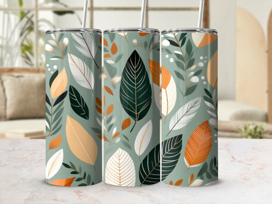 Three tumblers with a pattern of green leaves and beige feathers.