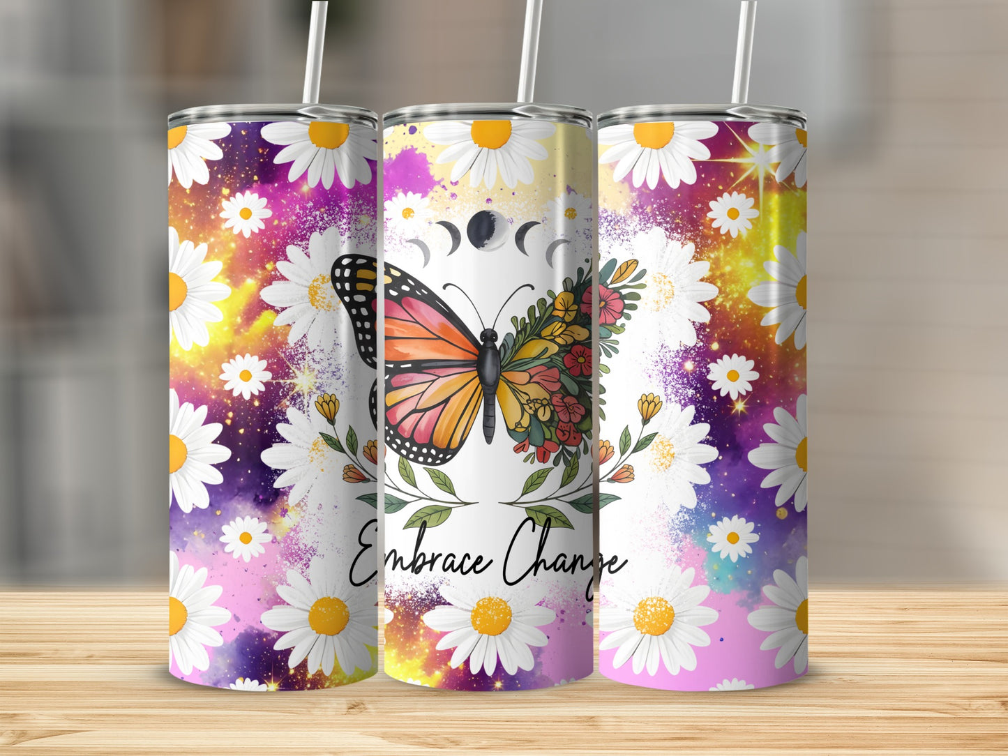 Tumbler with butterfly, daisies, moon phases, and "Embrace Change" text.