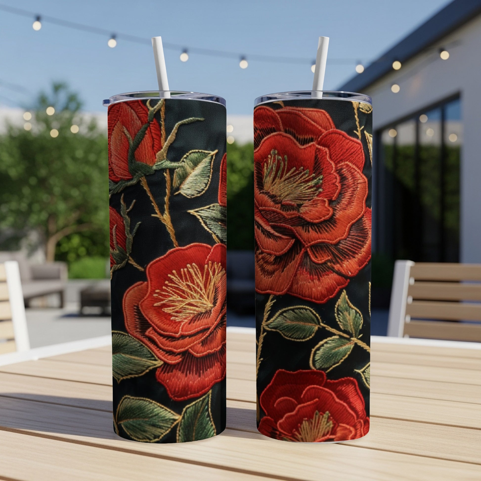 Two tall tumblers with a vibrant red rose embroidered design.