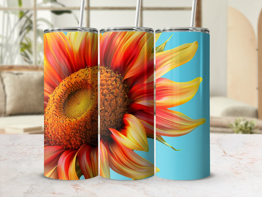 Three sunflowers on blue and marble patterned tumblers.