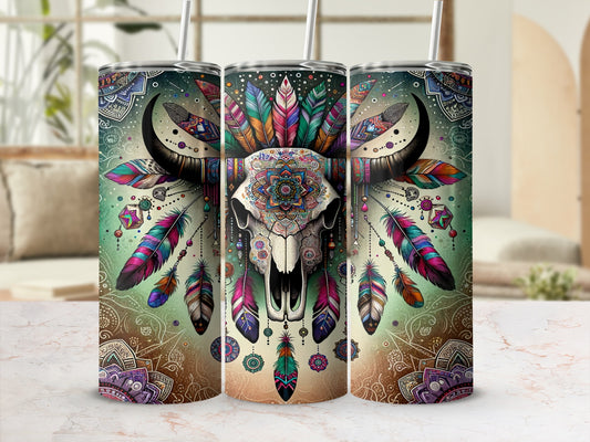 Bohemian buffalo skull with colorful feathers and mandala patterns on a tumbler.