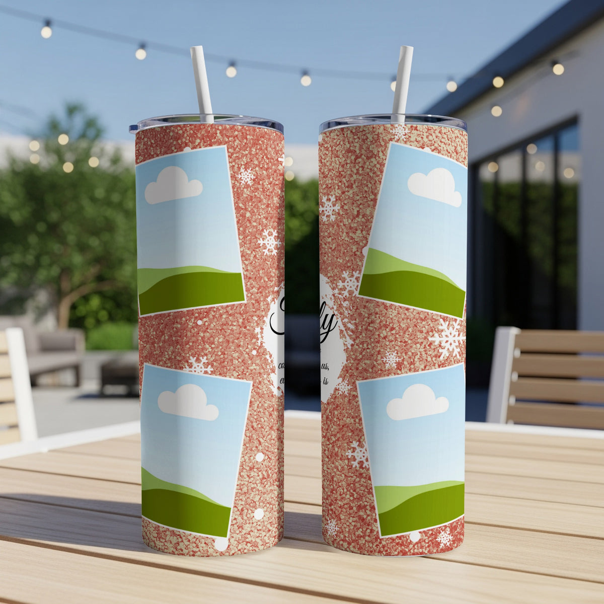 Two tumblers with rose gold glitter, snowflakes, and photo frames on a wooden table.