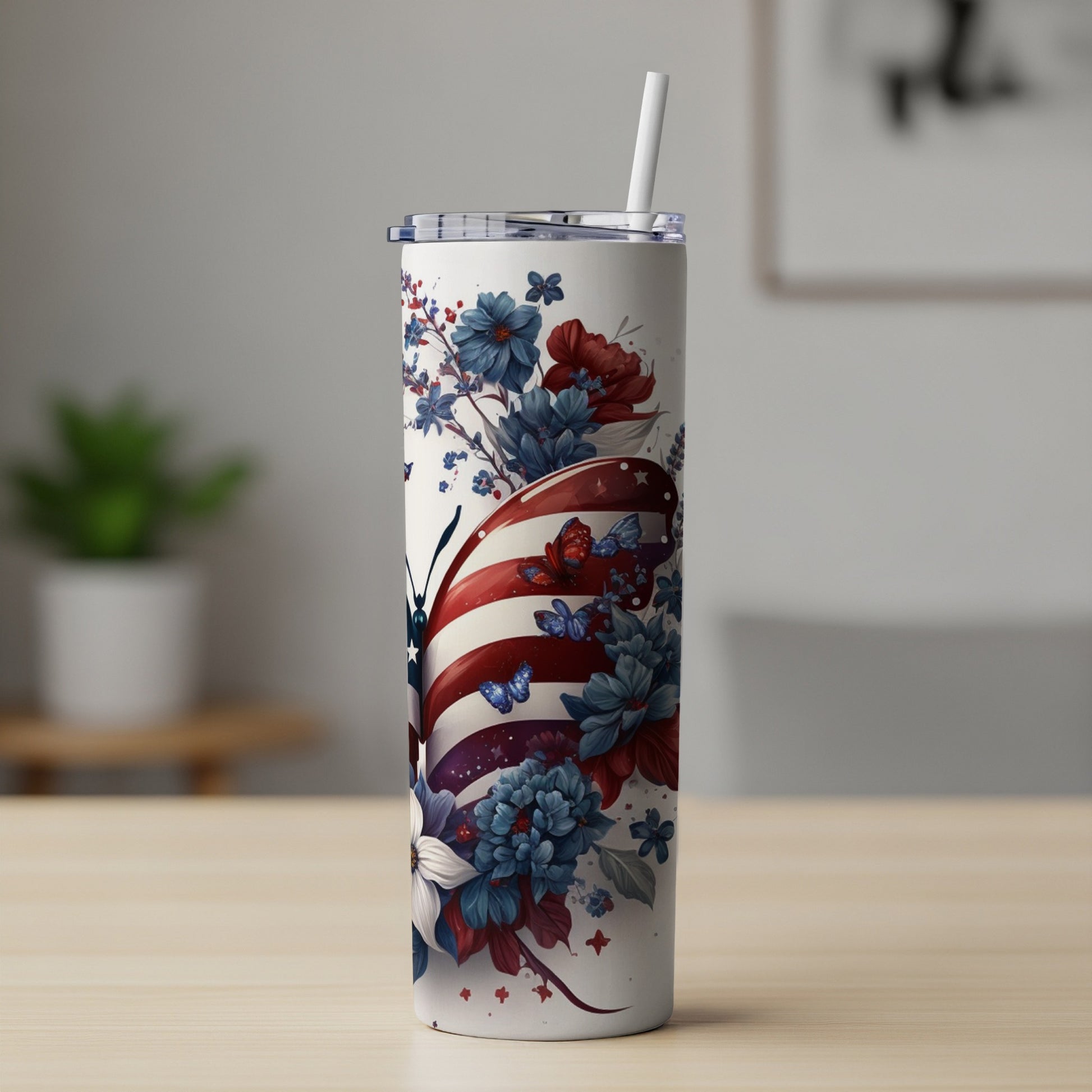 Tall tumbler with American flag butterfly and floral design.