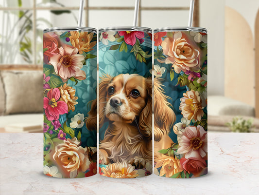 Brown Cavalier King Charles Spaniel surrounded by colorful flowers.