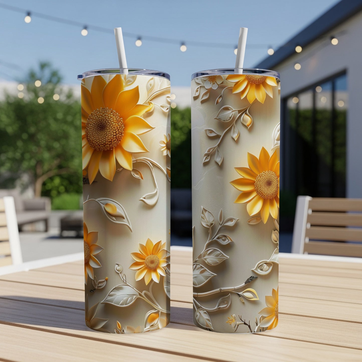 Two tall tumblers with sunflower and vine embossed design.