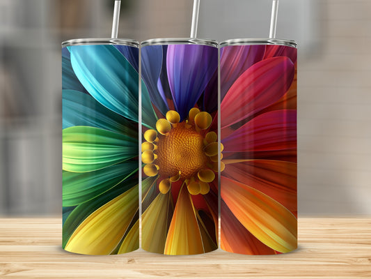 Three tumblers with rainbow flower design and straws, displayed on a wooden surface.