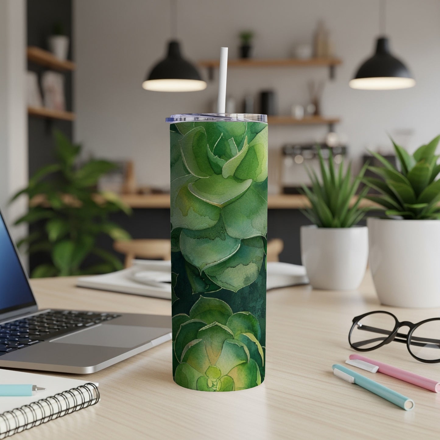Green succulent plant pattern on a stainless steel tumbler with straw.