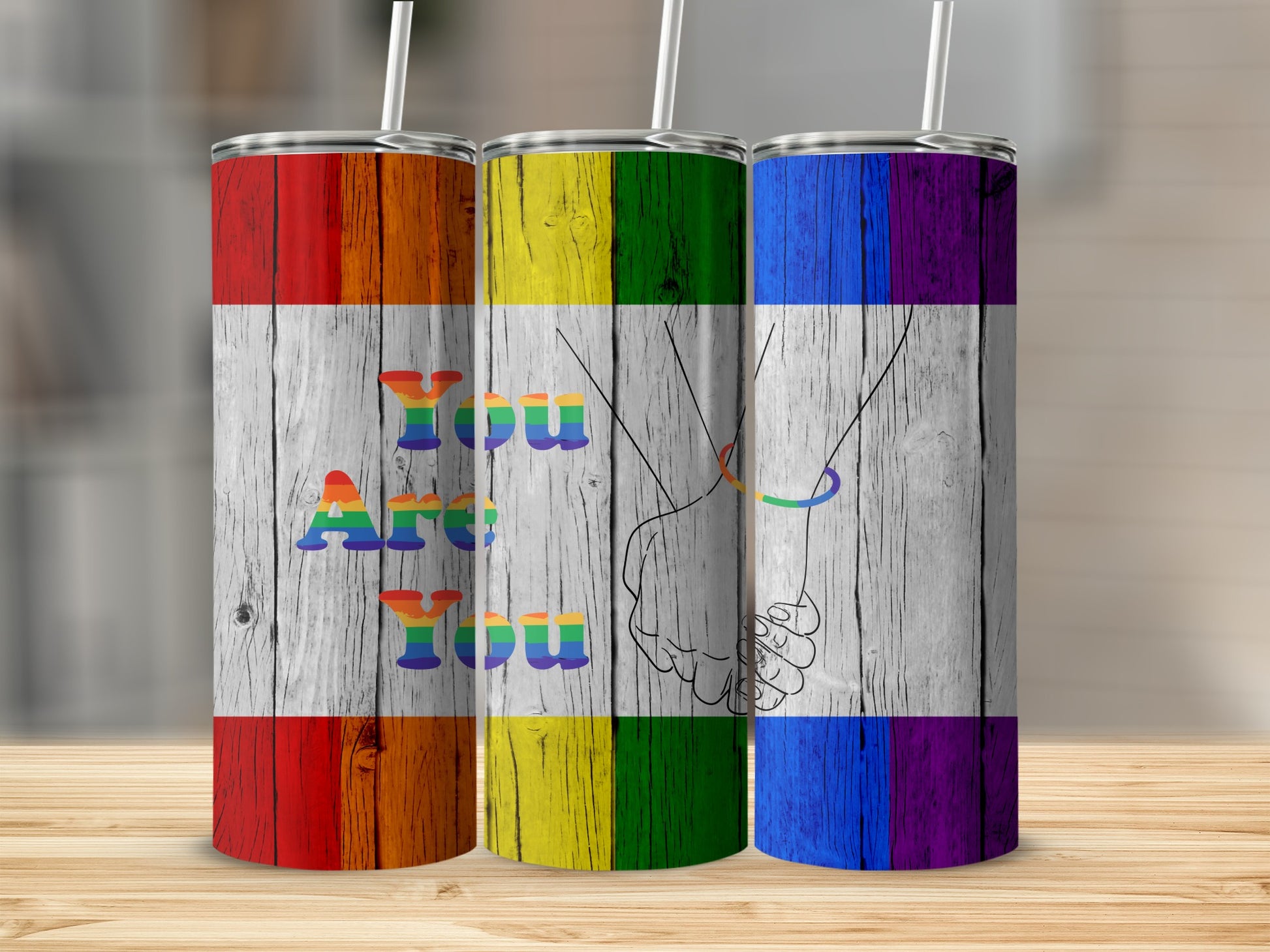 Three tumblers with rainbow flag design and "Are You" text.