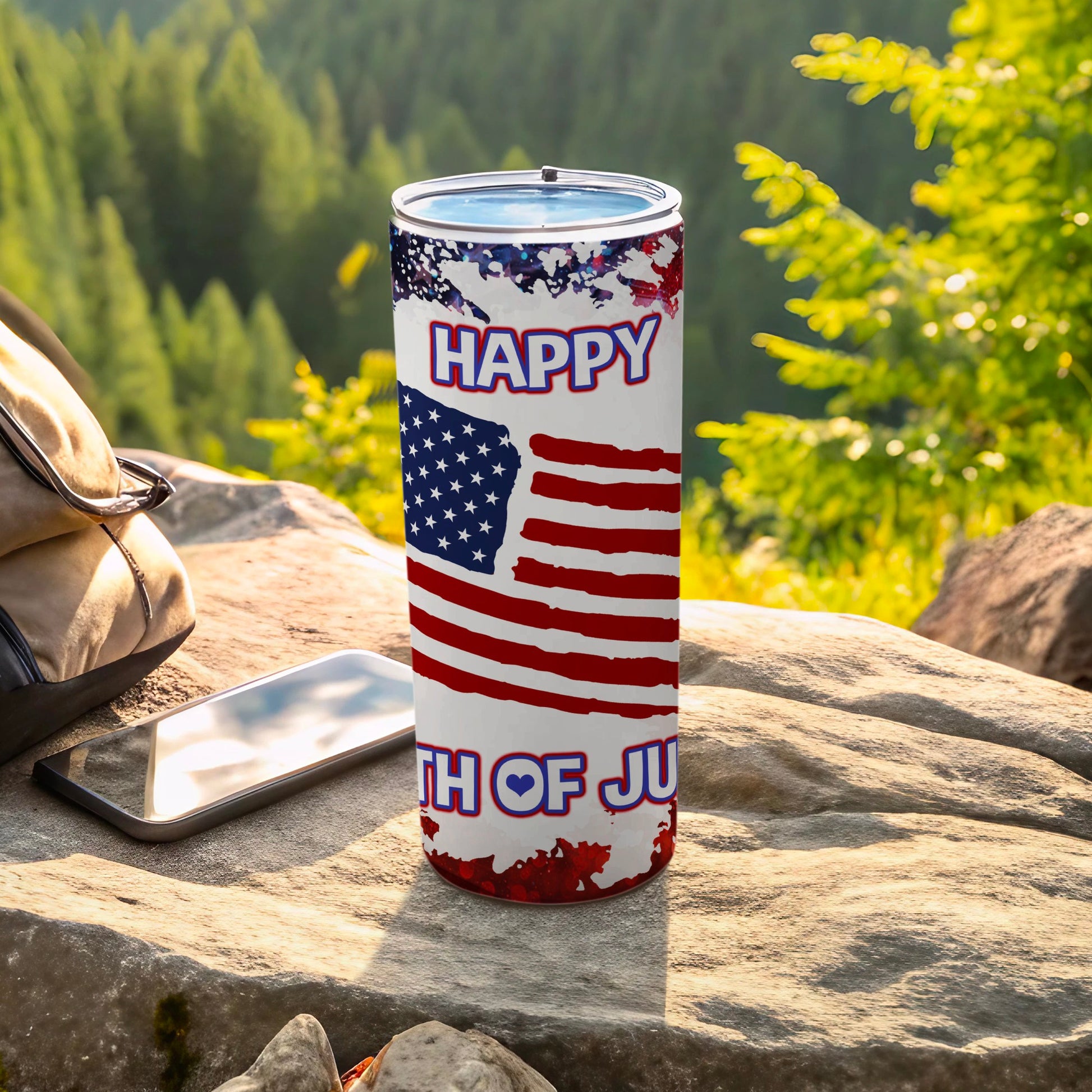 American flag tumbler with "Happy 4th of July" text on rocks.