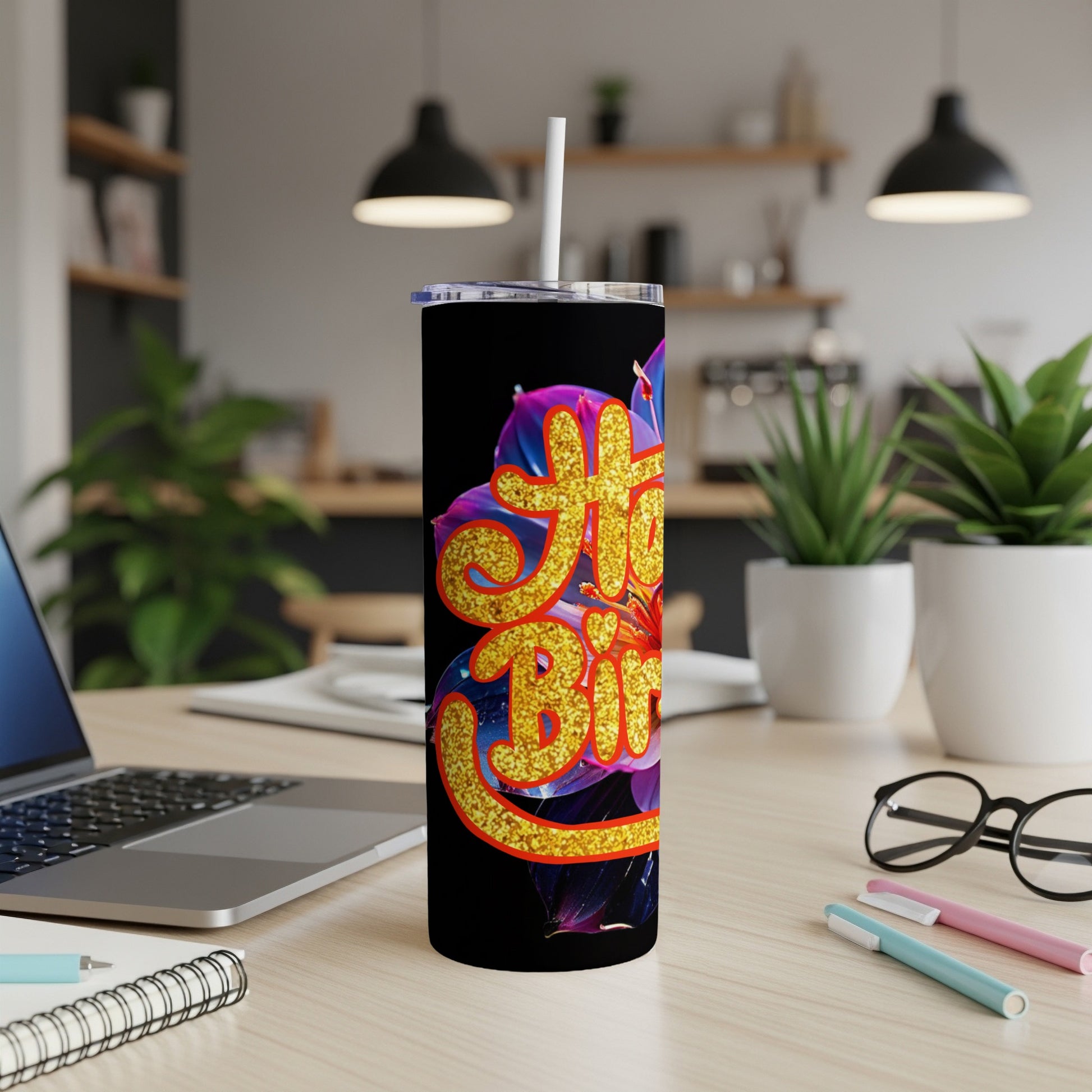Black tumbler with "Happy Birthday" in glittery gold lettering and floral accents.