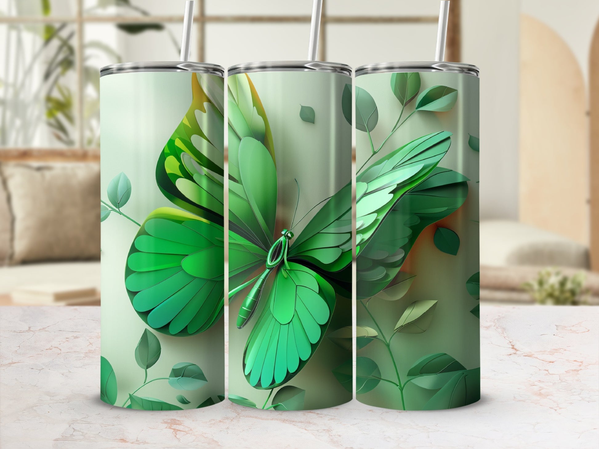 Green butterfly with leaves design on three tumblers.