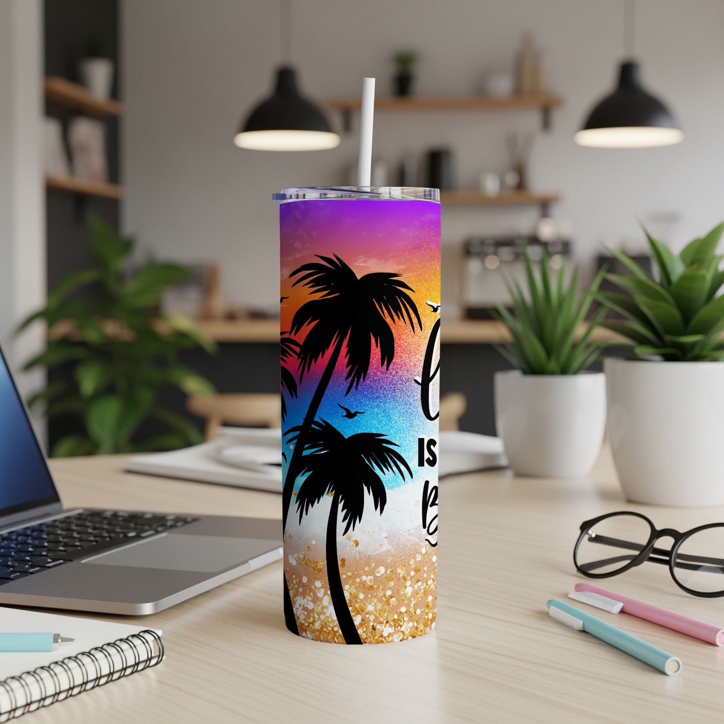 Tumbler with gradient sunset, palm trees, and glitter accents.