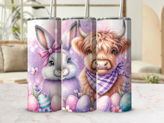 Easter bunny and Highland cow on tumblers with pastel eggs and flowers.