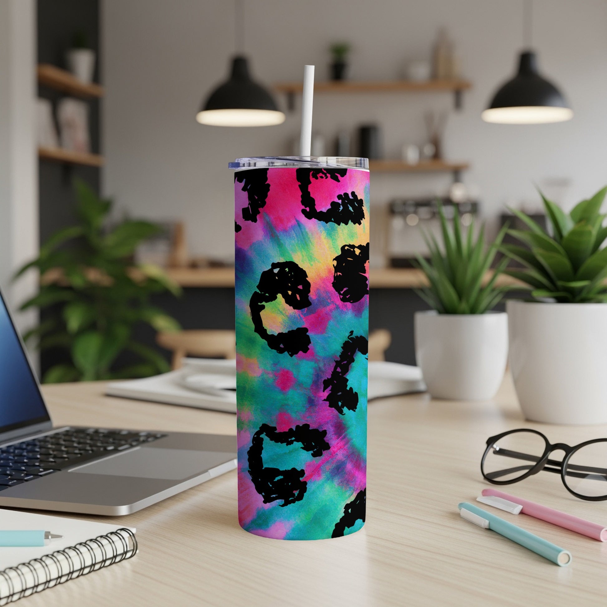 Tumbler with pink, blue, and green tie-dye pattern and black leopard print accents.