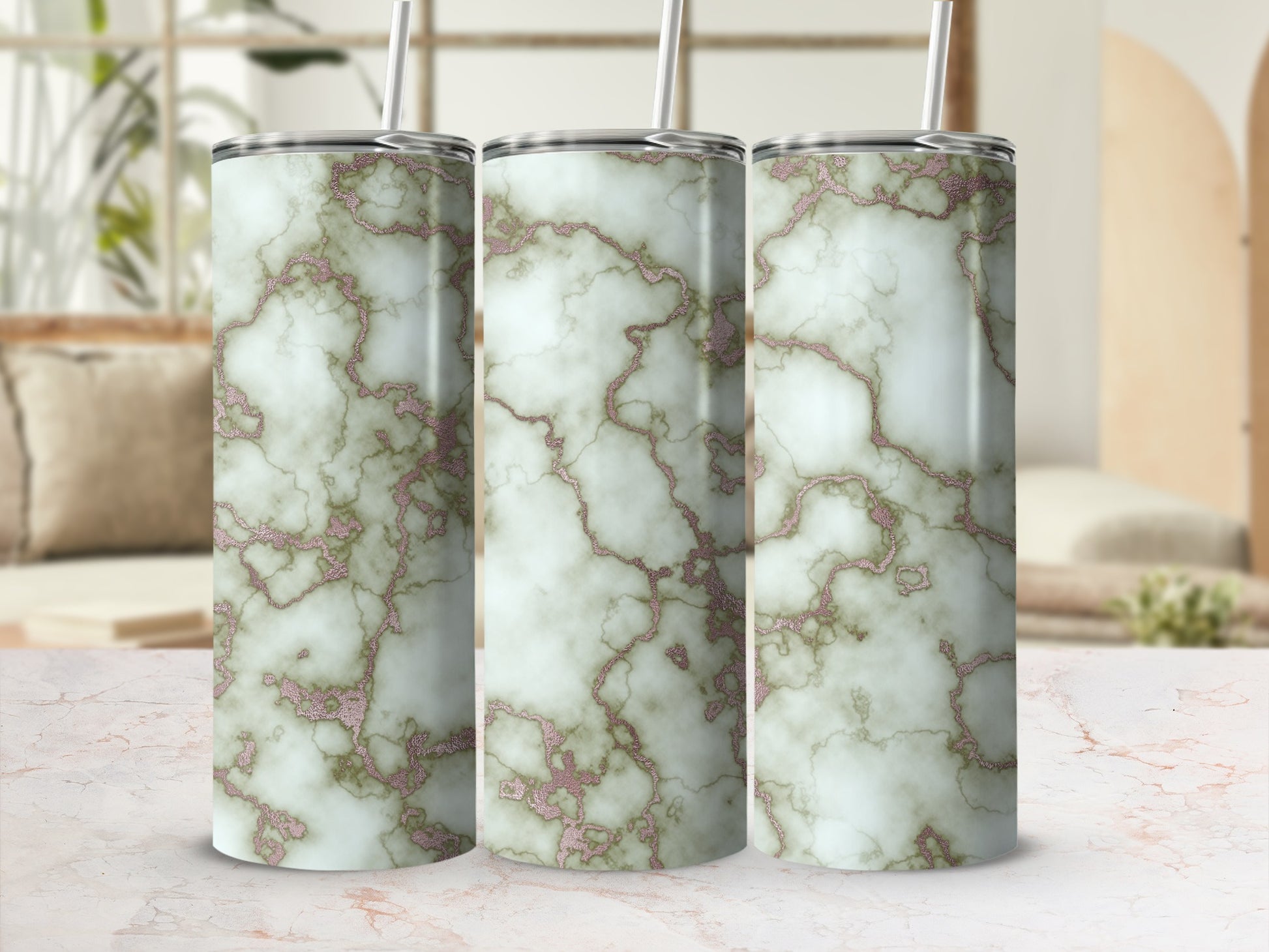 Three tumblers with a marble and rose gold glitter design.