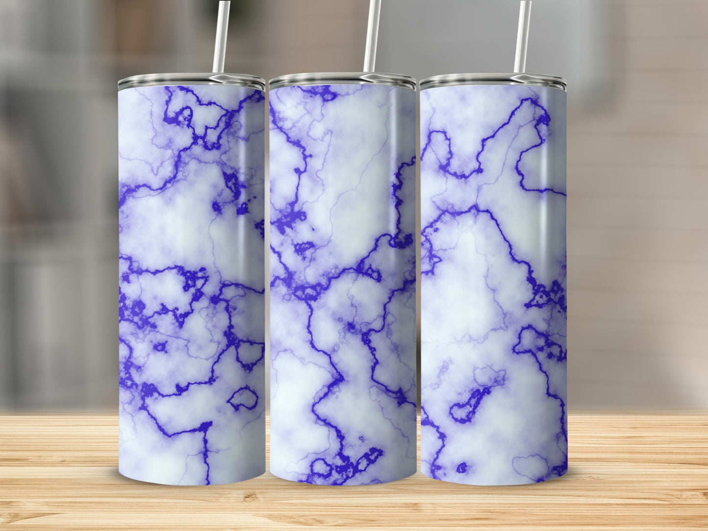 Three tumblers with a white and purple marble pattern, each with a straw.