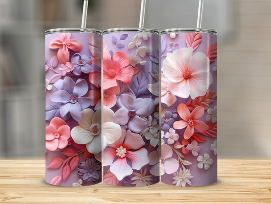 Three floral-patterned tumblers with pink, purple, and white flowers and leaves.