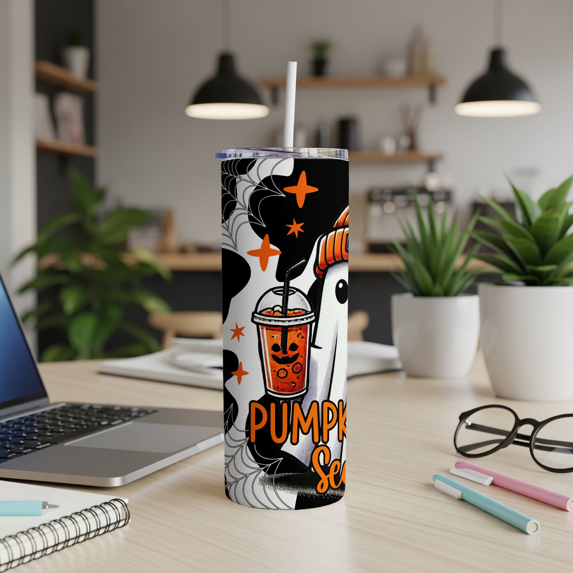 Tumbler with ghost, pumpkin drink, and "Pumpkin Spice" text with spiderwebs.